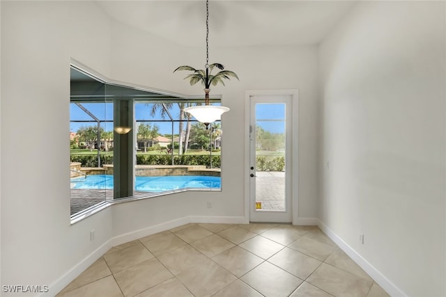 unfurnished dining area with light tile patterned floors