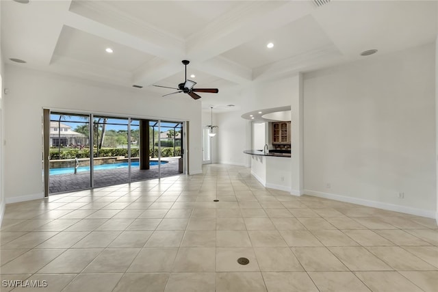 unfurnished living room featuring beamed ceiling, light tile patterned floors, ceiling fan, and coffered ceiling