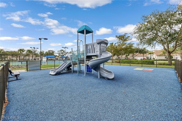 community jungle gym featuring fence