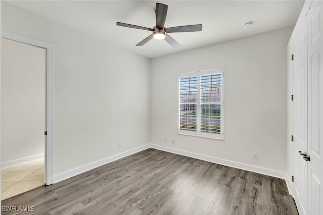 unfurnished bedroom with wood-type flooring and ceiling fan