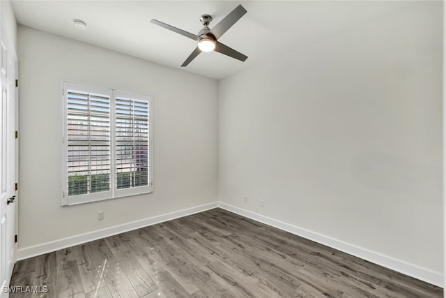 empty room featuring ceiling fan and wood-type flooring