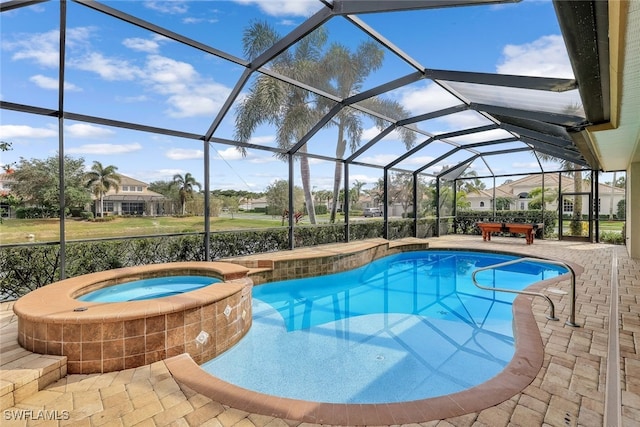 view of swimming pool featuring a lanai, a patio, and an in ground hot tub