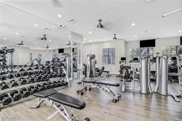 workout area with a ceiling fan, wood finished floors, visible vents, and recessed lighting