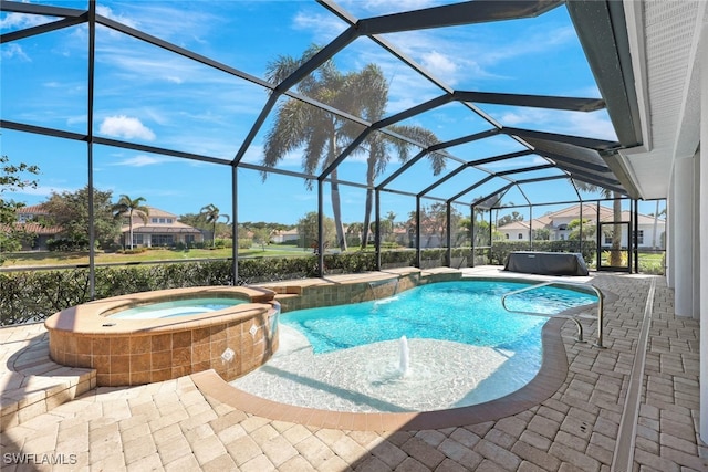 pool with a lanai, a patio area, an outdoor hot tub, and a residential view