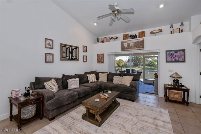 tiled living room featuring ceiling fan and high vaulted ceiling