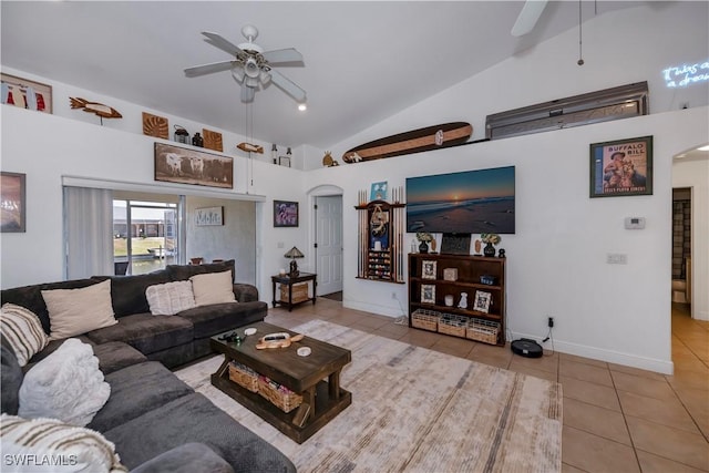 tiled living room with high vaulted ceiling and ceiling fan