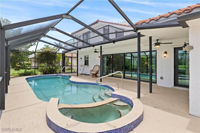 view of pool featuring a lanai, ceiling fan, and a patio