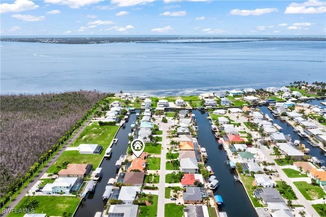 birds eye view of property featuring a water view