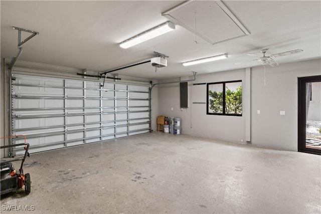 garage with ceiling fan and a garage door opener