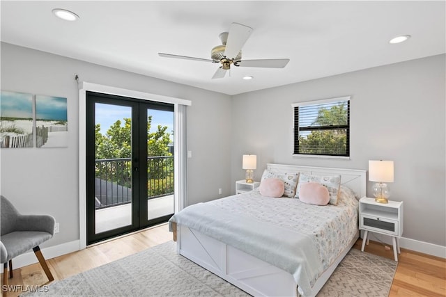 bedroom featuring access to outside, ceiling fan, french doors, and wood-type flooring