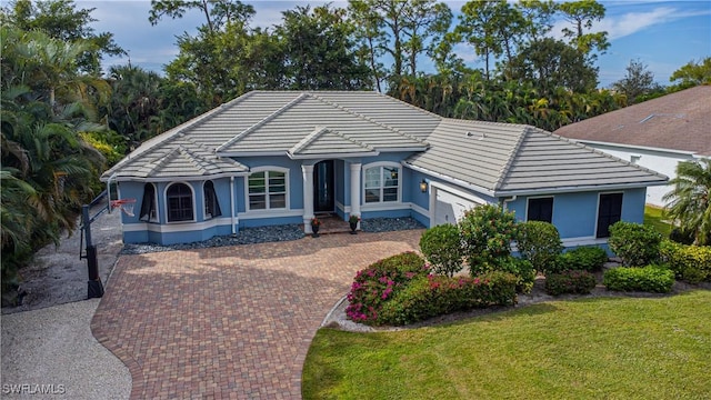 ranch-style home featuring a front yard