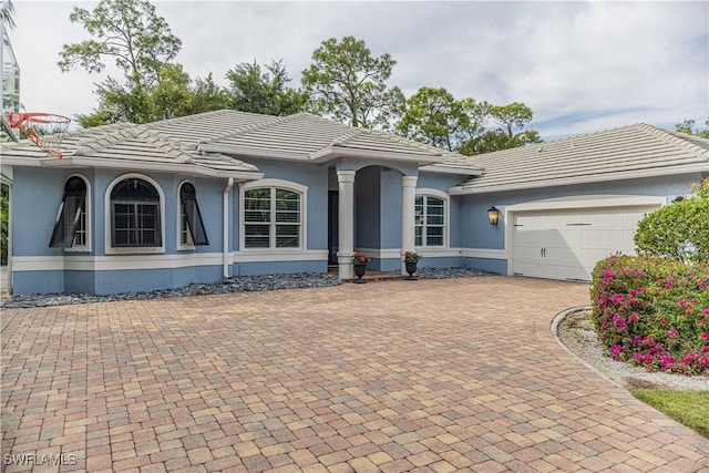 ranch-style house featuring a garage