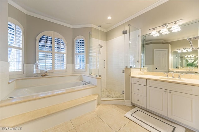 bathroom featuring tile patterned flooring, vanity, separate shower and tub, and crown molding