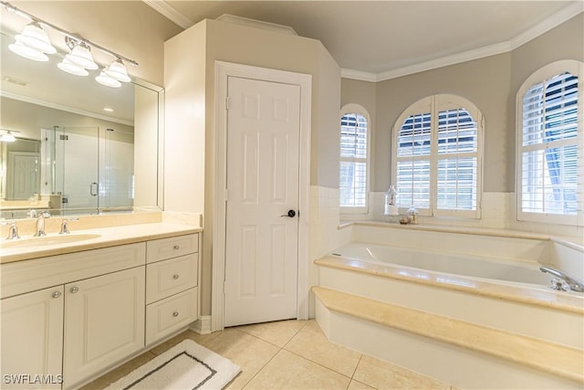 bathroom featuring plus walk in shower, tile patterned flooring, vanity, and ornamental molding