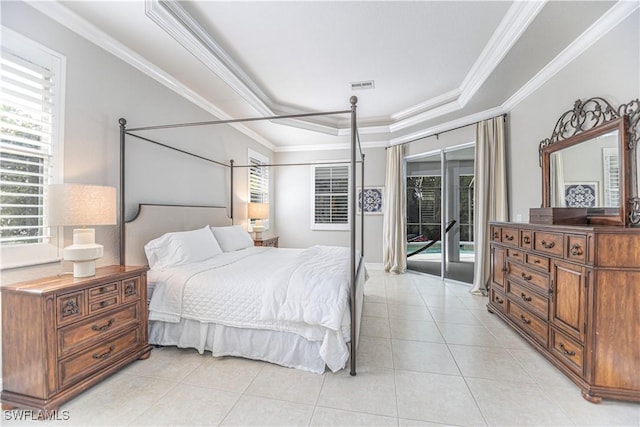 tiled bedroom featuring a tray ceiling, access to exterior, and crown molding