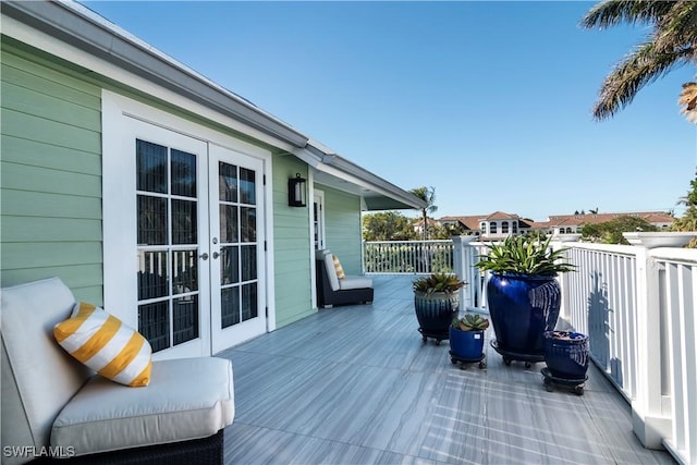 wooden deck featuring french doors