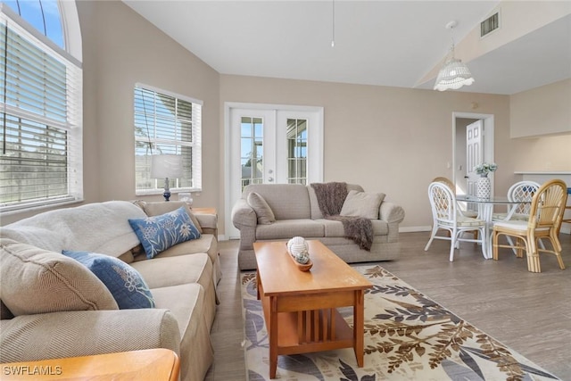 living room featuring hardwood / wood-style floors and lofted ceiling