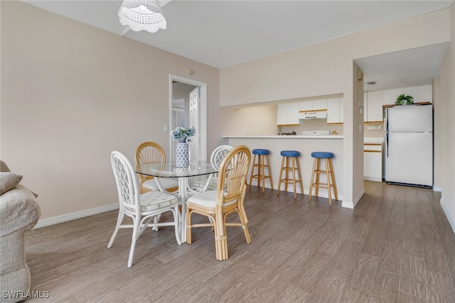 dining room with light wood-type flooring