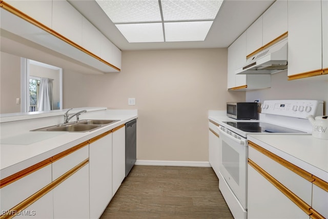 kitchen featuring sink, stainless steel appliances, dark hardwood / wood-style flooring, range hood, and white cabinets