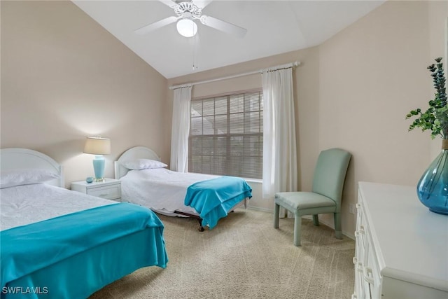 carpeted bedroom with vaulted ceiling and ceiling fan