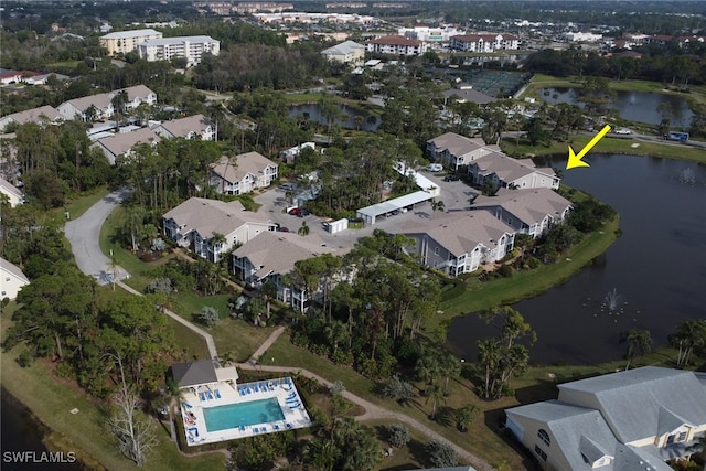 birds eye view of property with a water view