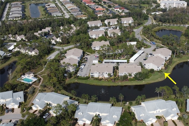 birds eye view of property featuring a water view