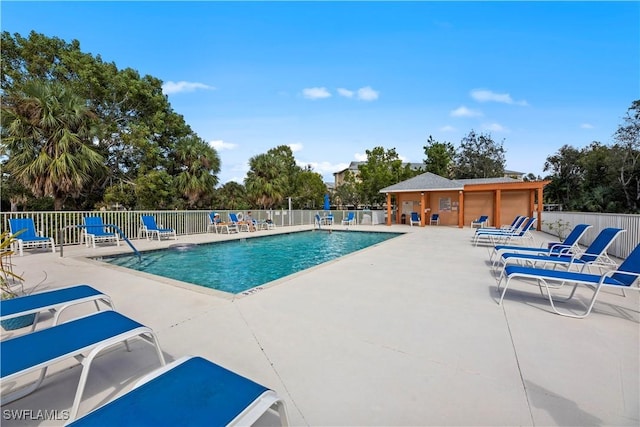 view of swimming pool with a patio area