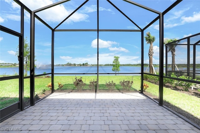 unfurnished sunroom with a water view