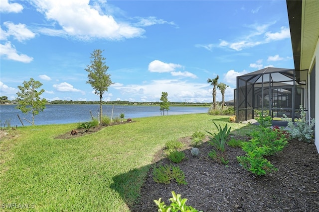 view of yard featuring a lanai and a water view