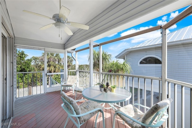 sunroom / solarium featuring vaulted ceiling and ceiling fan