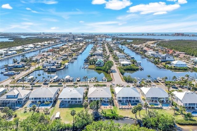 bird's eye view with a residential view and a water view