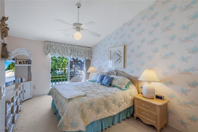 bedroom with light carpet, wallpapered walls, ceiling fan, access to outside, and vaulted ceiling