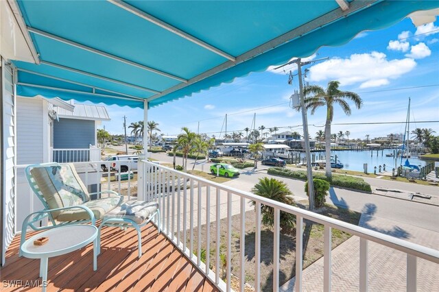 balcony featuring a water view