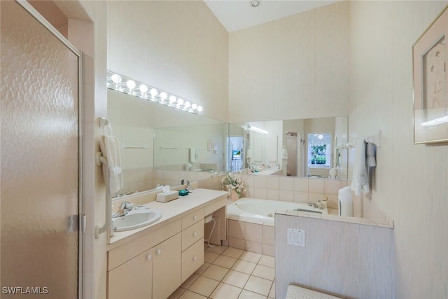 full bathroom featuring a stall shower, tile patterned flooring, a high ceiling, vanity, and a bath