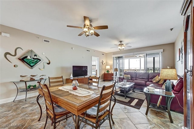 dining room featuring ceiling fan