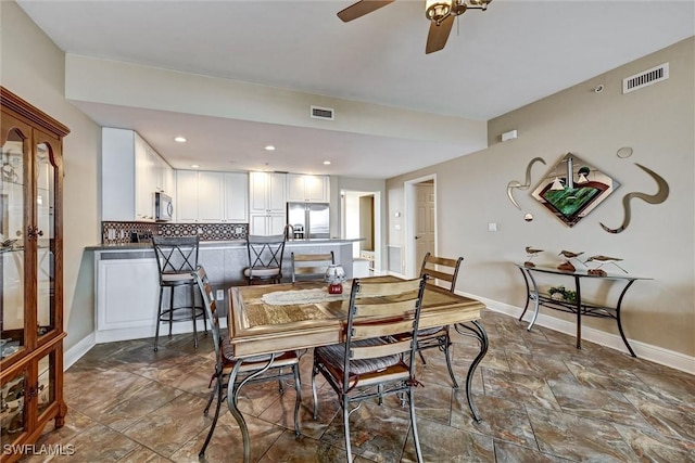 dining room featuring ceiling fan