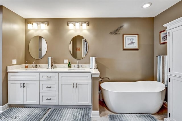 bathroom with vanity and a bathing tub