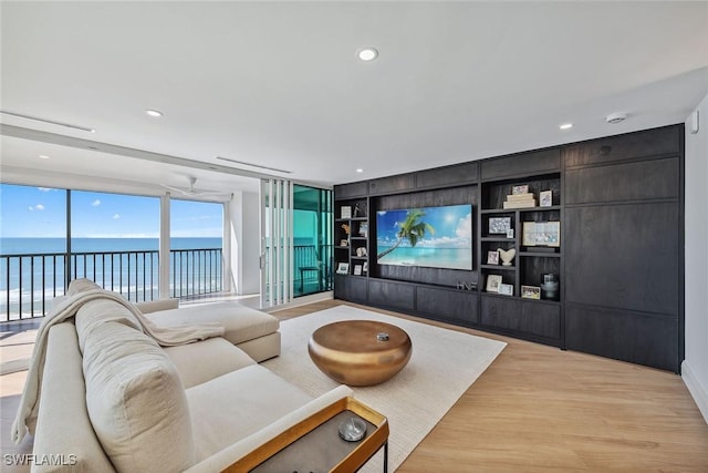 living room featuring light hardwood / wood-style floors and built in features