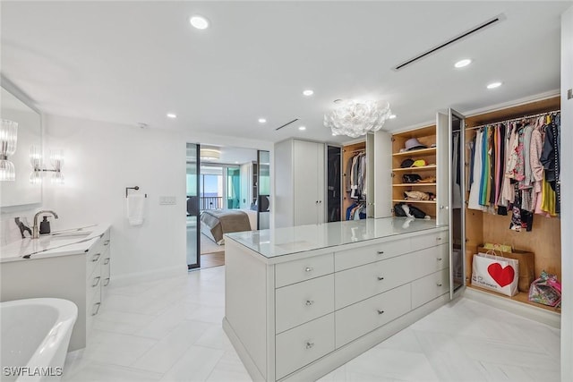 walk in closet with sink