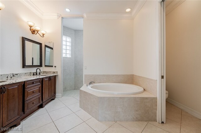 bathroom featuring vanity, tiled tub, tile patterned floors, and ornamental molding