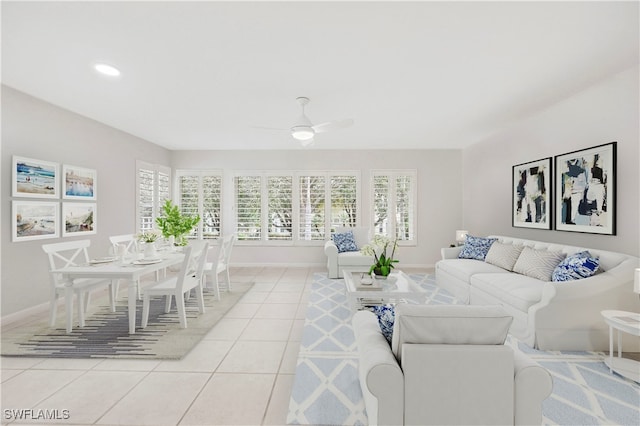 living room with ceiling fan and light tile patterned floors