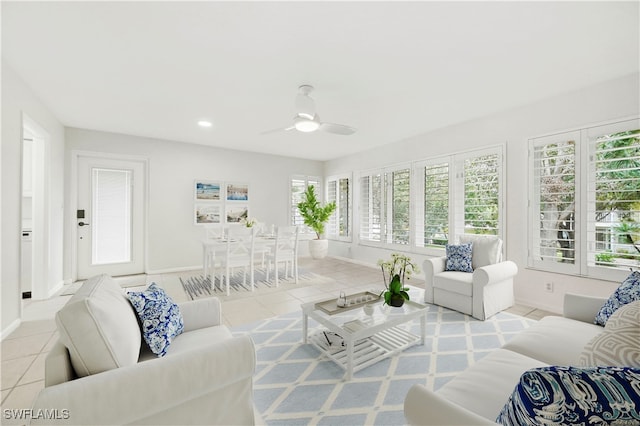 living room with ceiling fan and light tile patterned floors