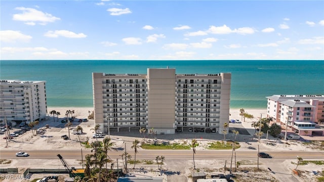 aerial view featuring a water view and a beach view