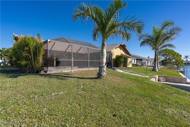 view of yard featuring a lanai