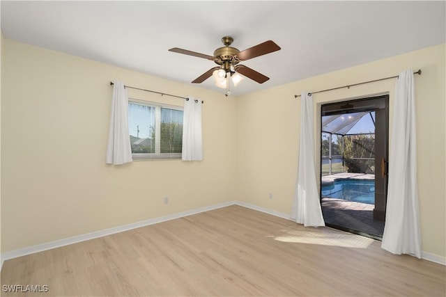 unfurnished room with ceiling fan and light hardwood / wood-style flooring