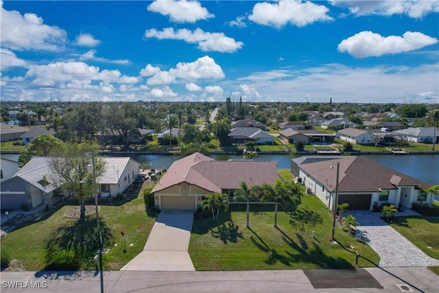 aerial view featuring a water view and a residential view