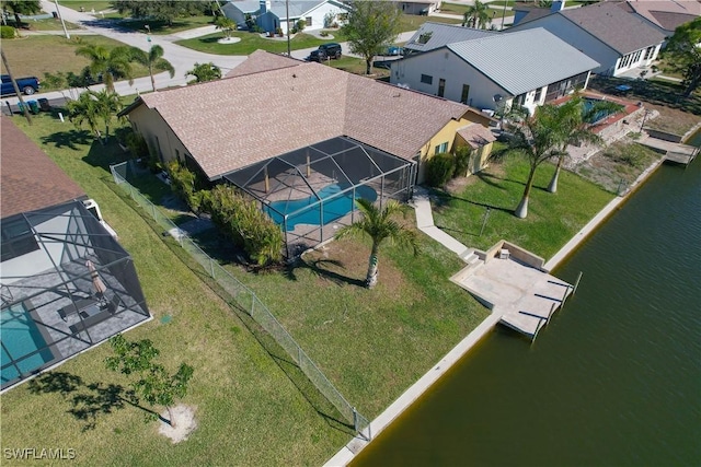 birds eye view of property with a water view and a residential view