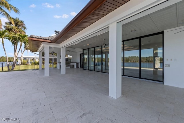 view of patio featuring ceiling fan