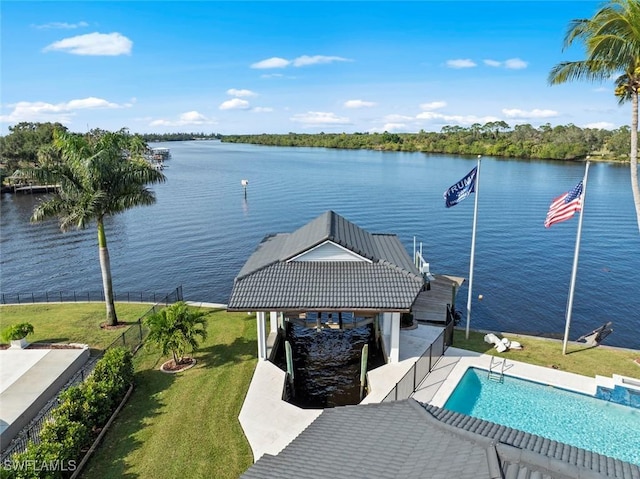 view of dock featuring a yard and a water view