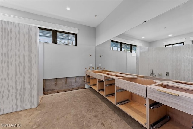 bathroom with concrete flooring and a wealth of natural light